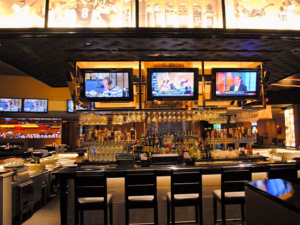 casino bar with TVs overhead