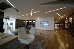 digital sign display featured on the wall of an office lobby setting