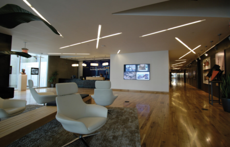 digital signage digital sign display featured on the wall of an office lobby setting