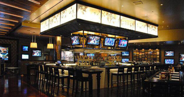 video screens above casino bar