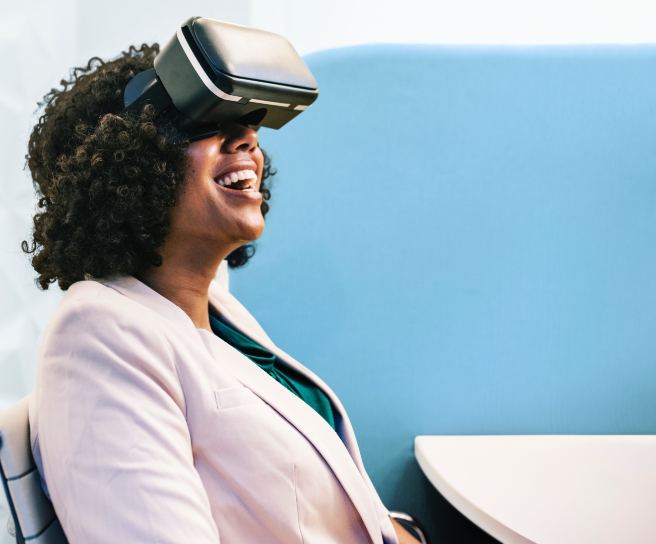 a woman using a VR device for training purposes and smiling