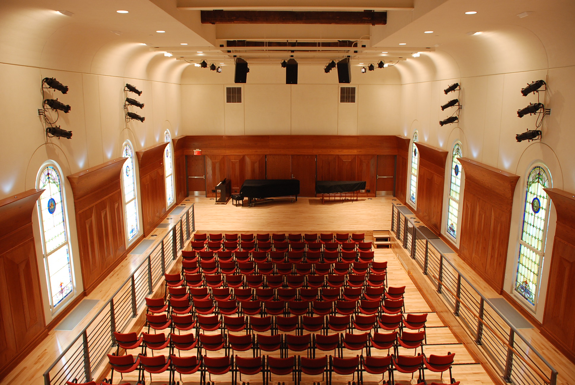 large auditorium with speakers
