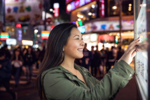 touch screen interactive digital signage, woman used digital sign in london