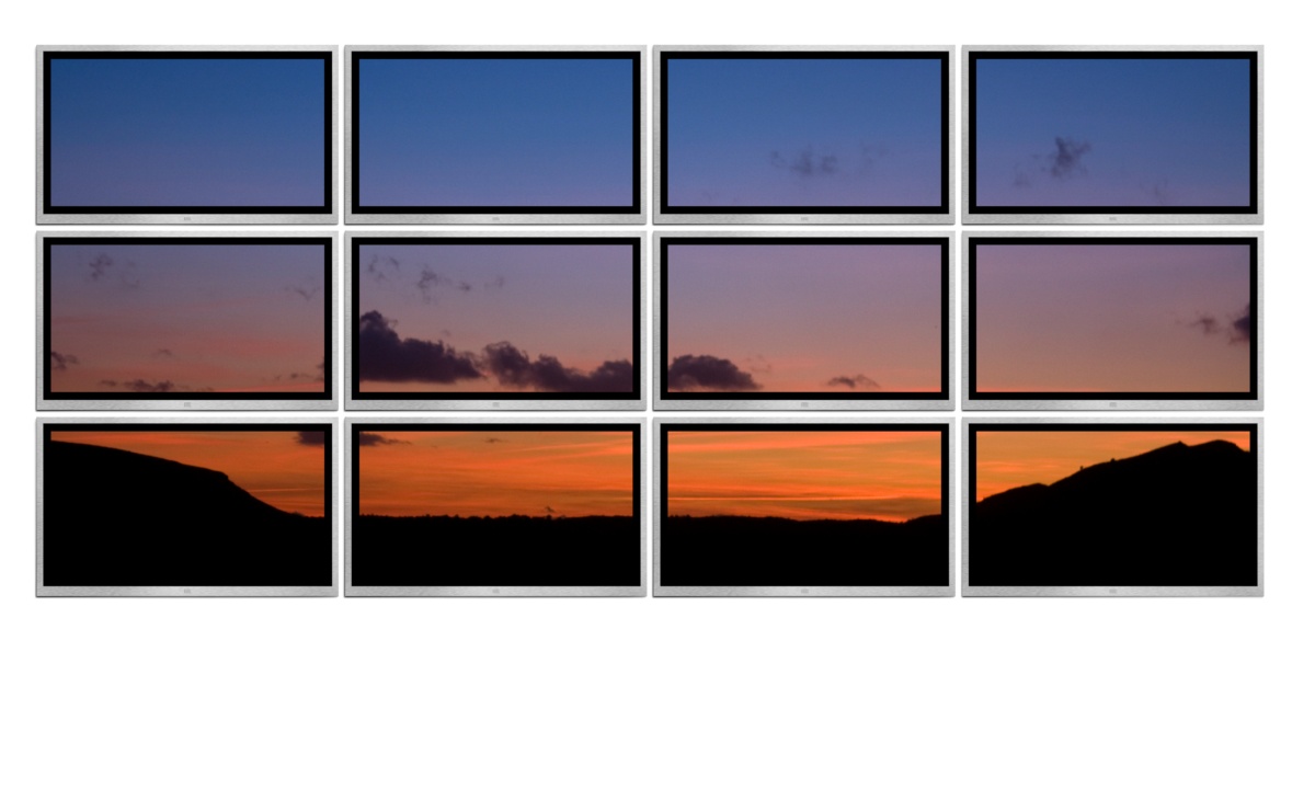 Wall of twelve TV screens showing a single image Wall of 12 TV screens showing a single image