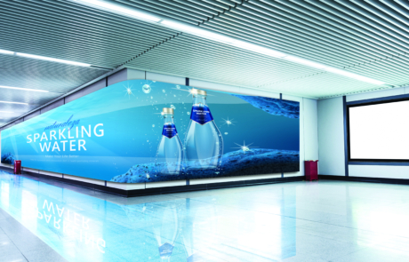 curved digital signage along an airport wall