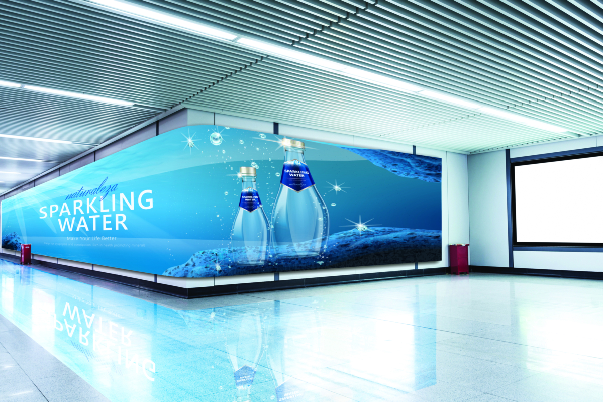 curved digital signage along an airport wall