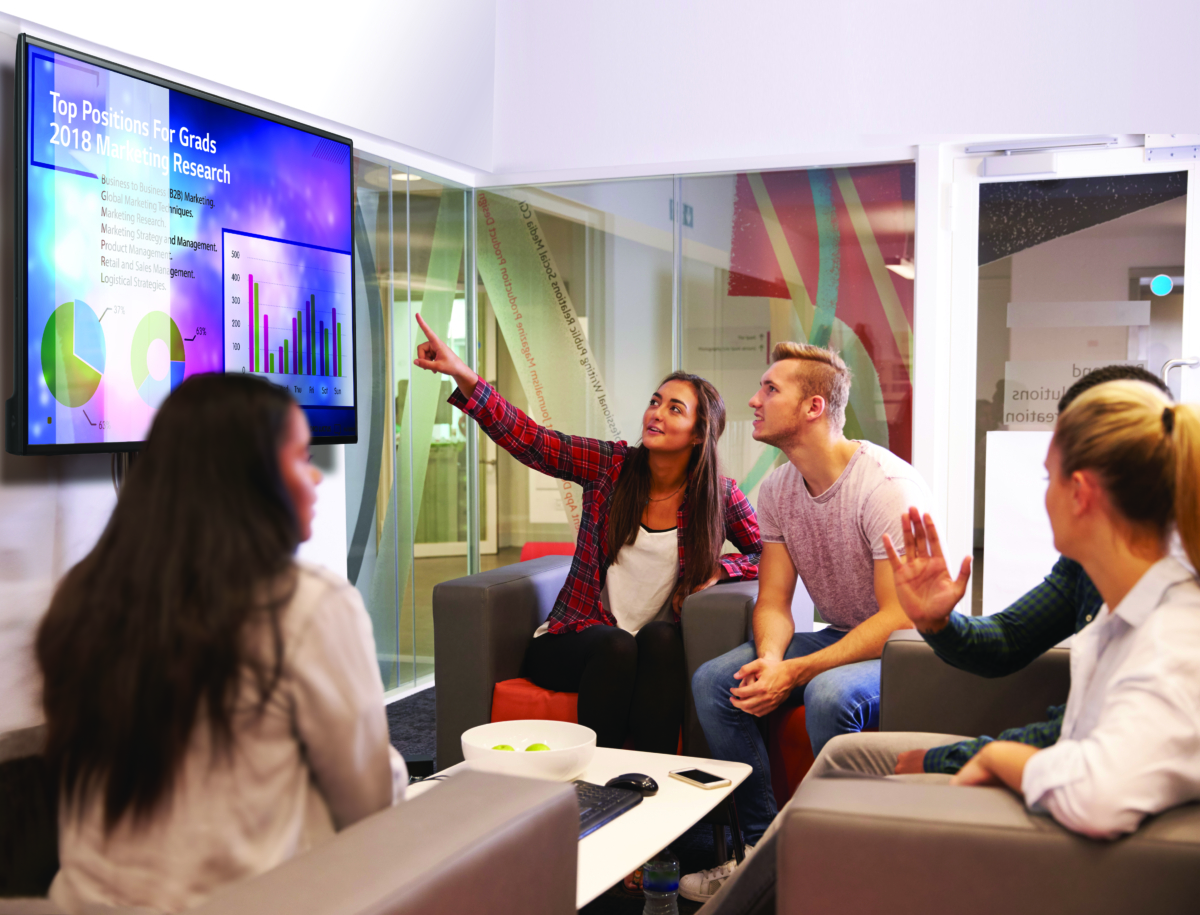 Group Of University Students Discussing Project Together LG Business Solutions