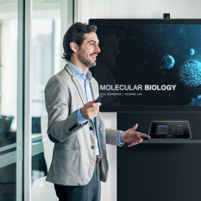 education Man giving a presentation next to a display and touch panel