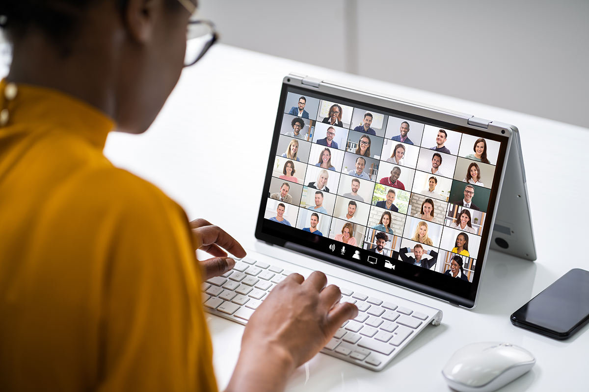 woman in a video call with many participants