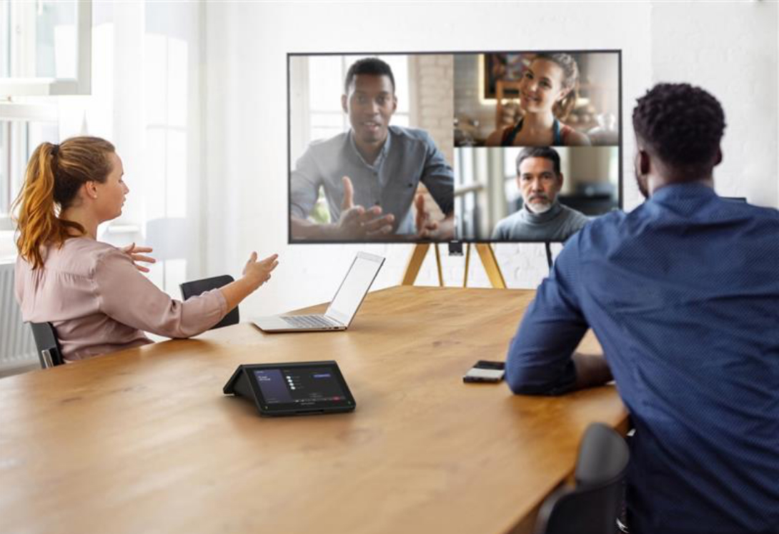 a man and a woman speaking in video call looking at screen 