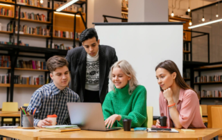 study group gathered around laptop
