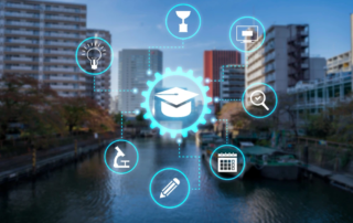 city skyline with education icons and monitor symbol