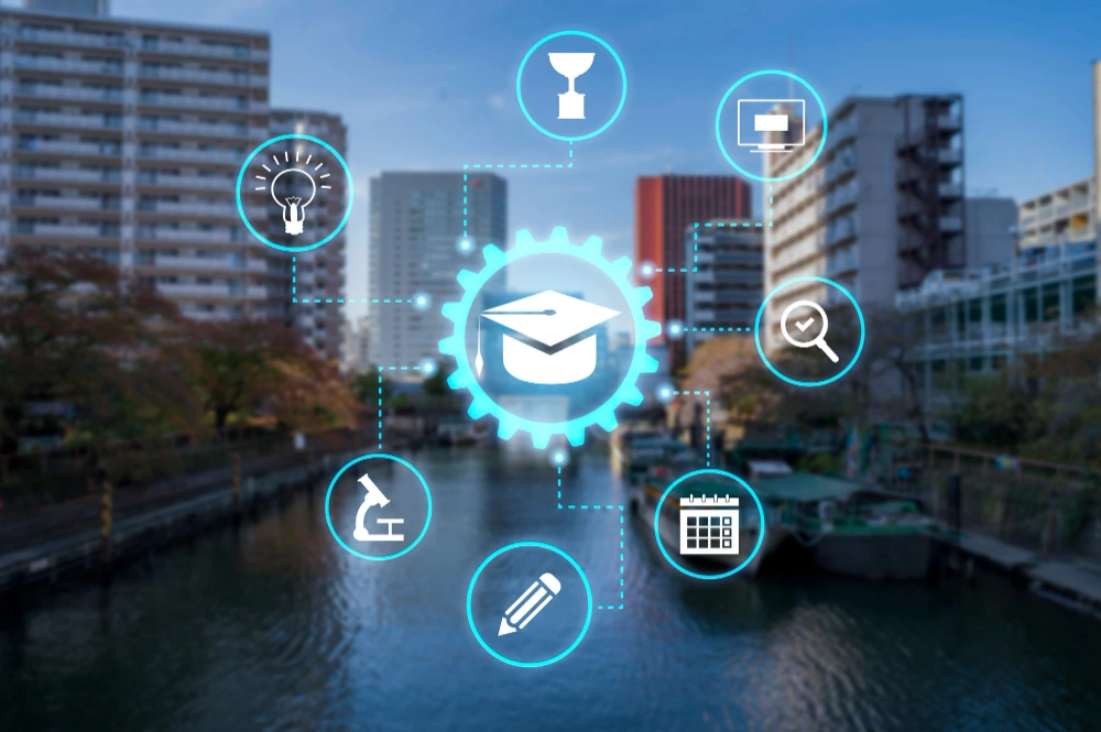 city skyline with education icons and monitor symbol