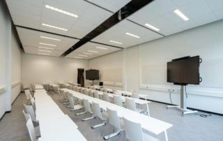 empty classroom with two large monitors