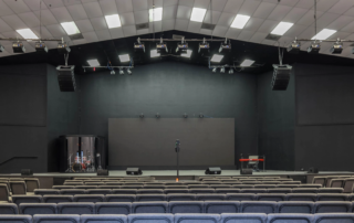 auditorium with stage and sound equipment
