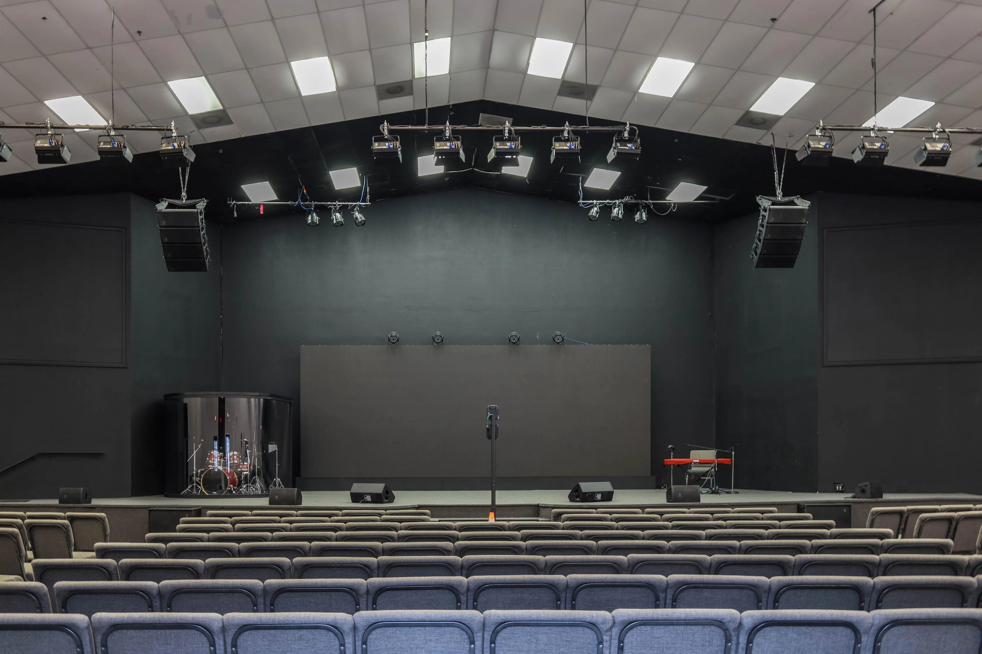 auditorium with stage and sound equipment