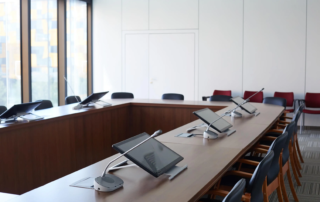 conference room table with tablet and microphone