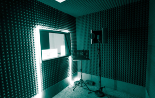 Soundproof recording booth with microphone and music stand