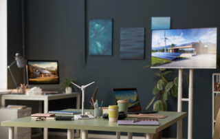 modern office desk with monitor laptop wind turbine model