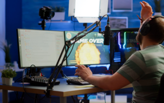 Streamer gaming with dual monitors microphone camera and LED light