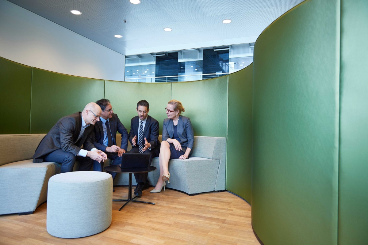 Men and Women doing business meeting with a Laptop