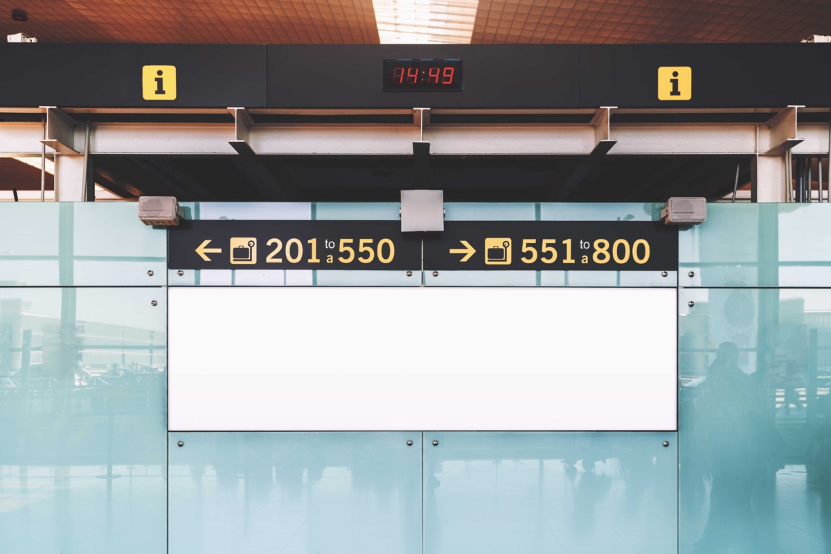 Directional baggage signage with left arrow 201 to 550 right arrow 551 to 800 above blank display panel