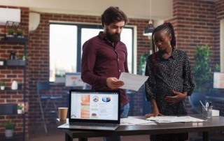 Employees reviewing annual reports