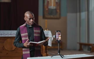 priest performing online in the church