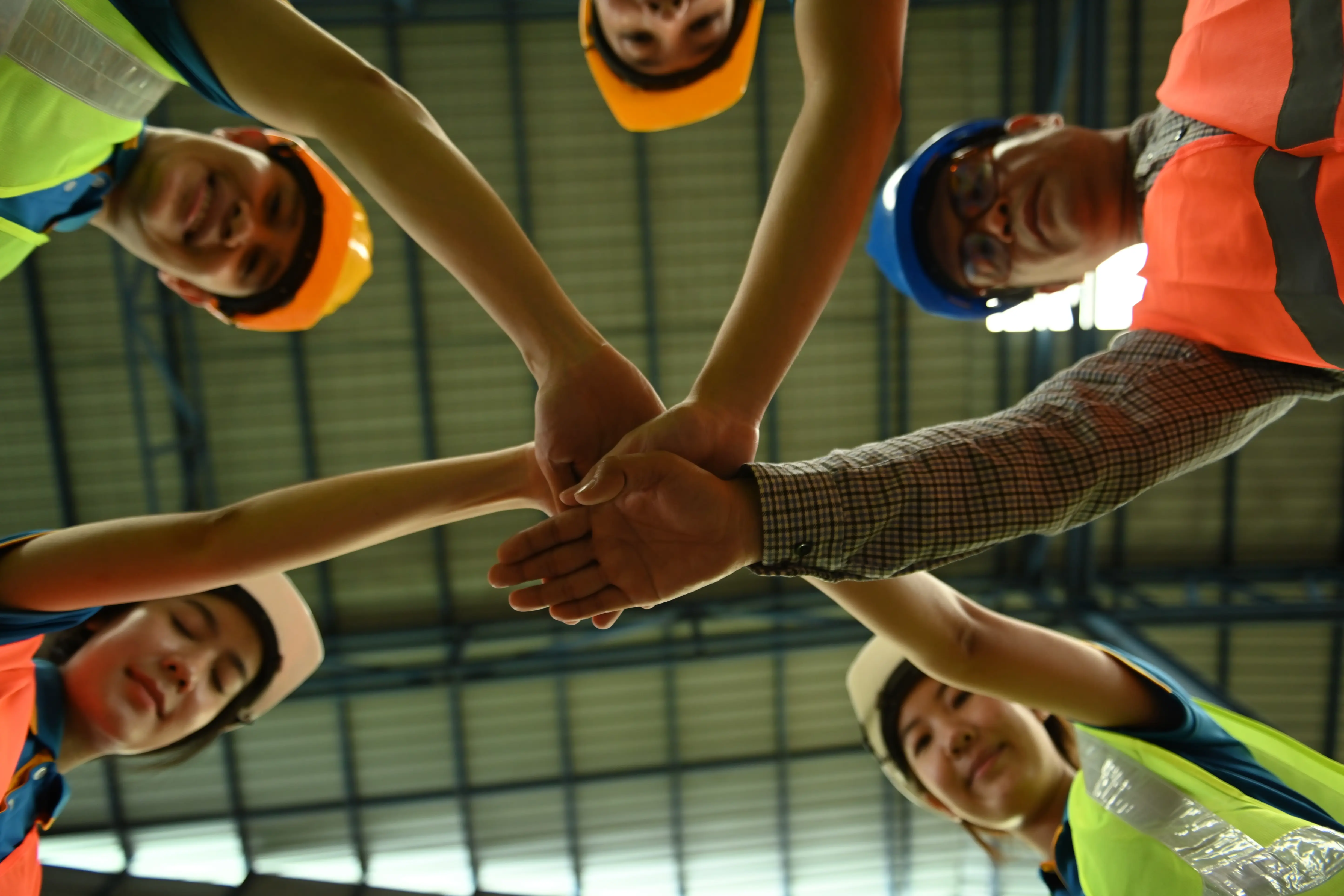 unity-supporting-and-teamwork-concept-2024-12-02-06-16-20-utc 5 team mates with hands as unity