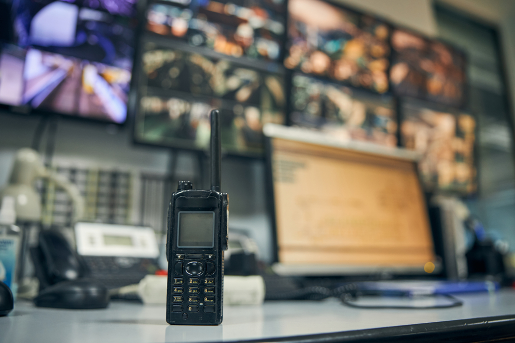 Walkie-talkie placed on an office desk in a control room