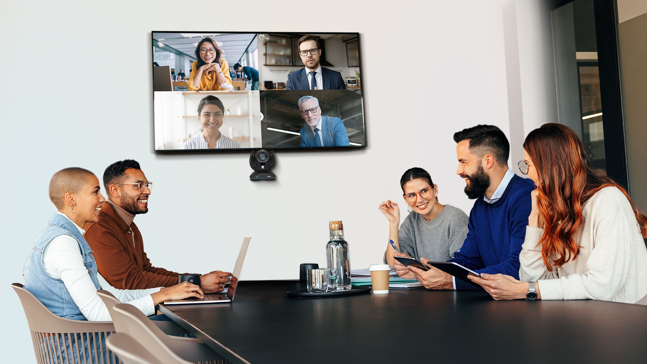 Happy businesspeople having a meeting in a boardroom Aver
